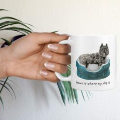 Home is where my dog is Bouvier des Flandres hand holding plant