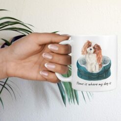 Home is where my dog is Cavalier King Charles Spaniel hand holding plant