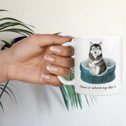 Home is where my dog is Malamute hand holding plant