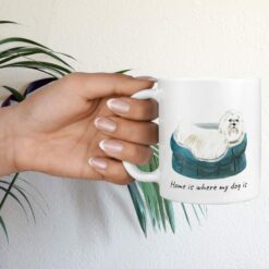 Home is where my dog is Maltese hand holding plant