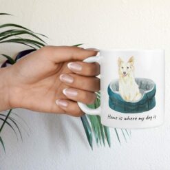 Home is where my dog is White Collie hand holding plant