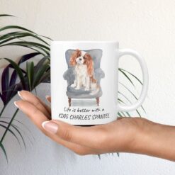 Life is better with a Cavalier King Charles Spaniel dog mug (Illustrated collection) 11 Life is better with Cavalier King Charles Spaniel Designs mug in hand plant