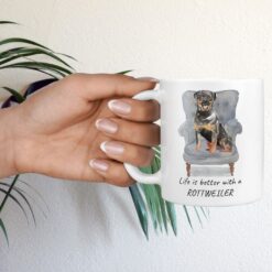 Life is better with Rottweiler Designs hand holding plant