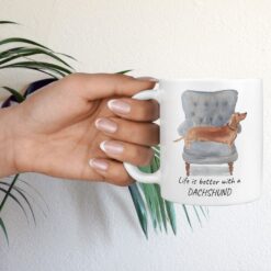 Life is better with Tan Dachshund Designs hand holding plant