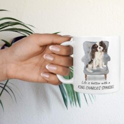 Life is better with Tri colour King Charles Spaniel Designs hand holding plant