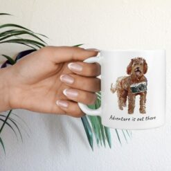 adventure is out there dog mug labradoodle hand holding plant