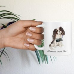 Adventure is out there Tri colour King Charles Spaniel dog mug (Illustrated collection) 17 adventure is out there dog mug tri colour king charles spaniel hand holding plant