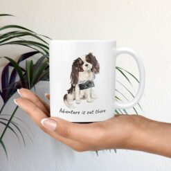 Adventure is out there Tri colour King Charles Spaniel dog mug (Illustrated collection) 19 adventure is out there dog mug tri colour king charles spaniel mug in hand plant