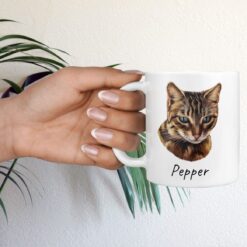 personalised pet portrait mug cat painting hand holding plant